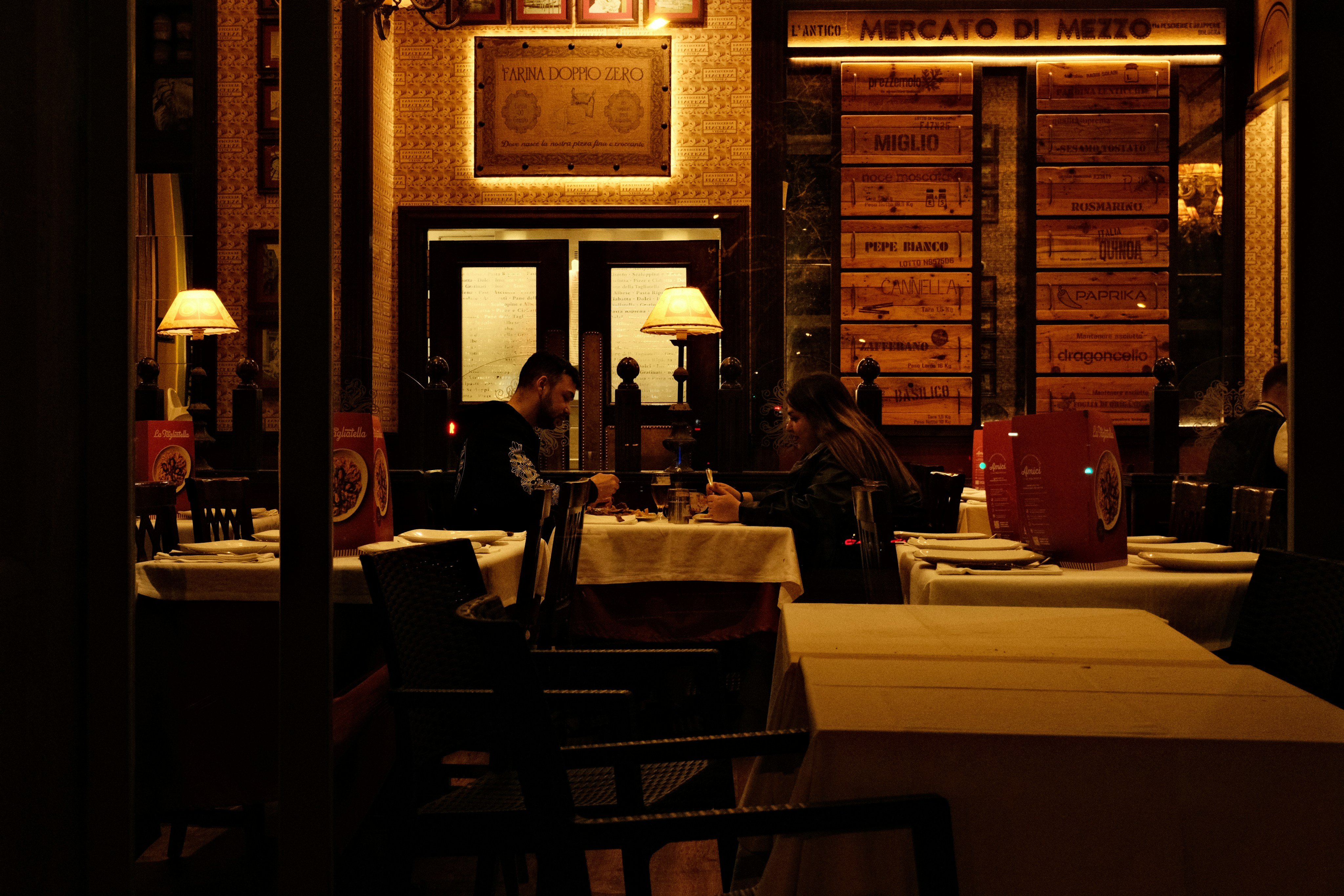 Warm candlelit interior of an Italian trattoria
